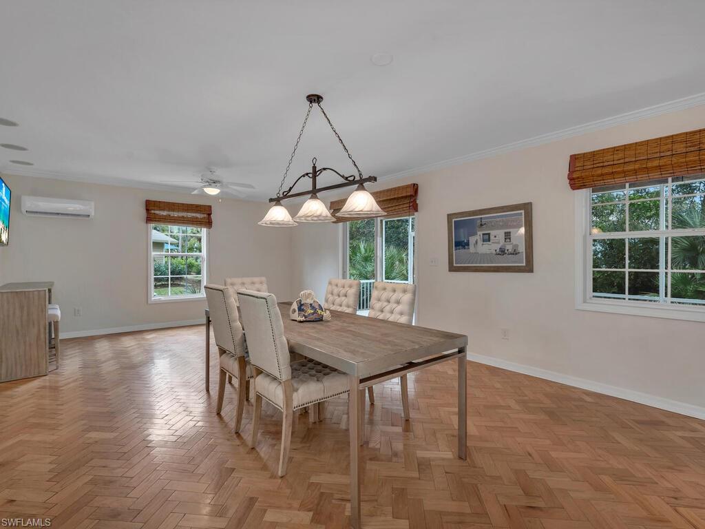 558 Corbel Drive Naples, FL 34110 - Photo 13 of 22 a view of a dining room with furniture window and outside view