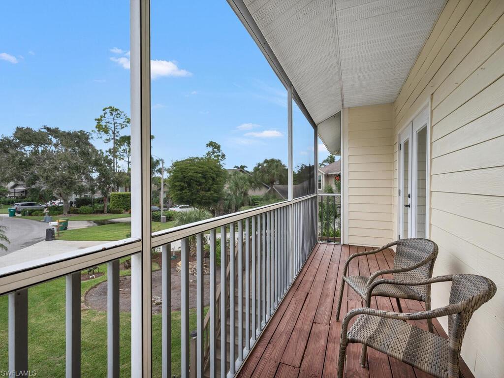 558 Corbel Drive Naples, FL 34110 - Photo 15 of 22 a view of a balcony with chairs