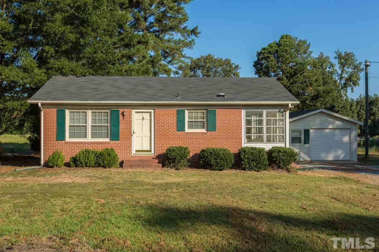 5405 Cheek Road Durham, NC 27704 - Photo 1 of 24 a front view of a house with garden