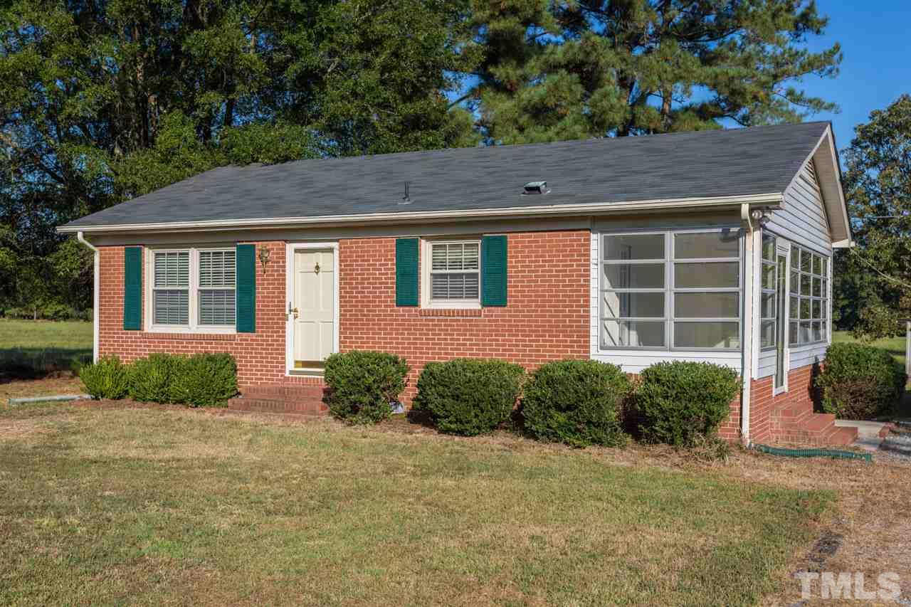 5405 Cheek Road Durham, NC 27704 - Photo 3 of 24 a front view of a house with garden
