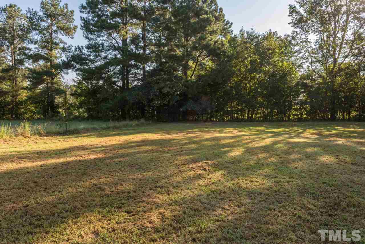 5405 Cheek Road Durham, NC 27704 - Photo 23 of 24 a view of a swimming pool with an outdoor space and seating area