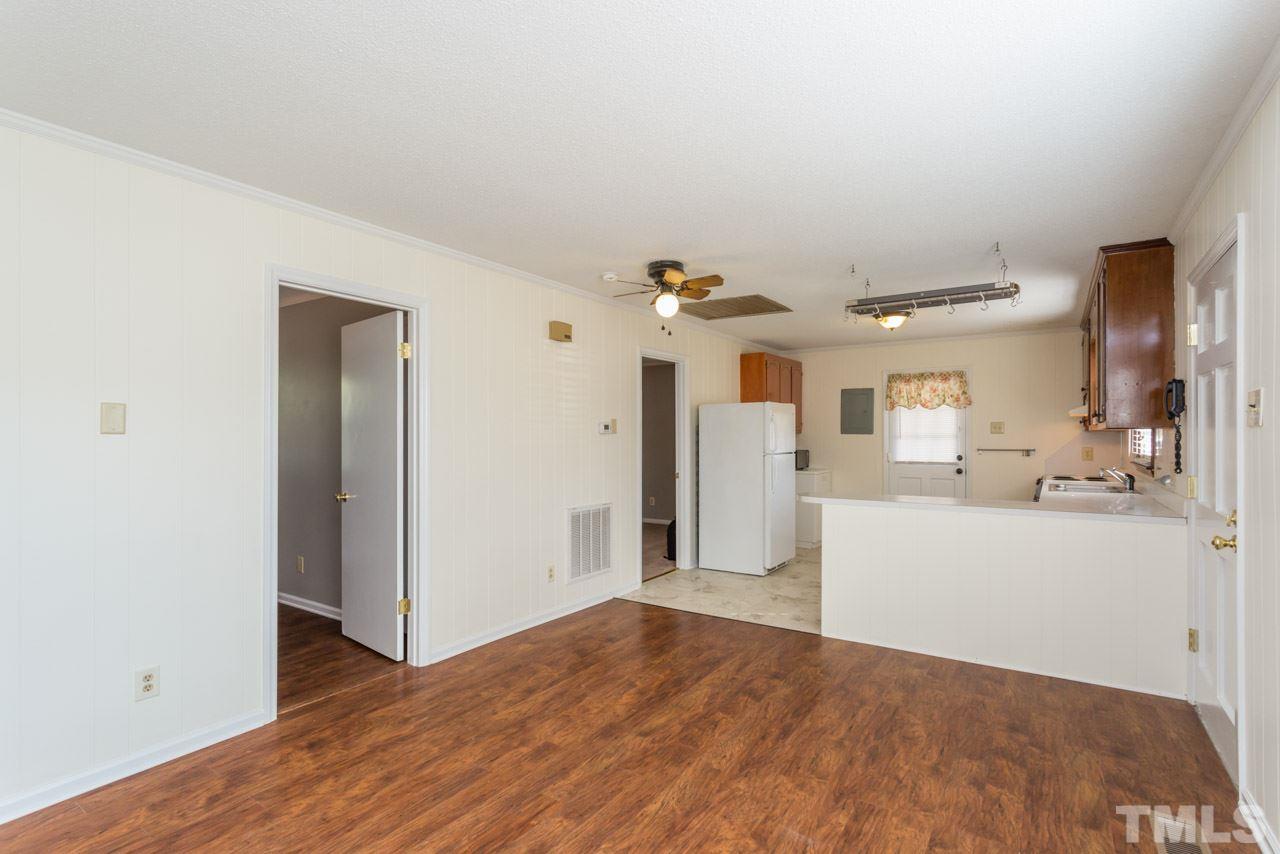 5405 Cheek Road Durham, NC 27704 - Photo 7 of 24 a view of a kitchen with wooden floor