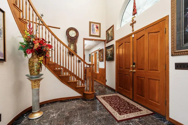 a living room with furniture a window and a fireplace