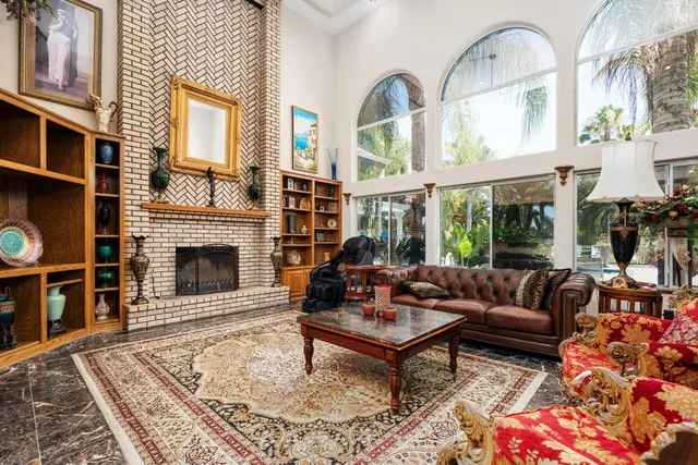 a bedroom with furniture and a flat screen tv