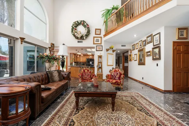 a view of a livingroom with furniture and windows