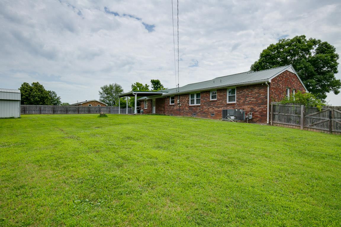 110 Black Road Dickson, TN 37055 - Photo 3 of 24 a view of a house with a yard and sitting area