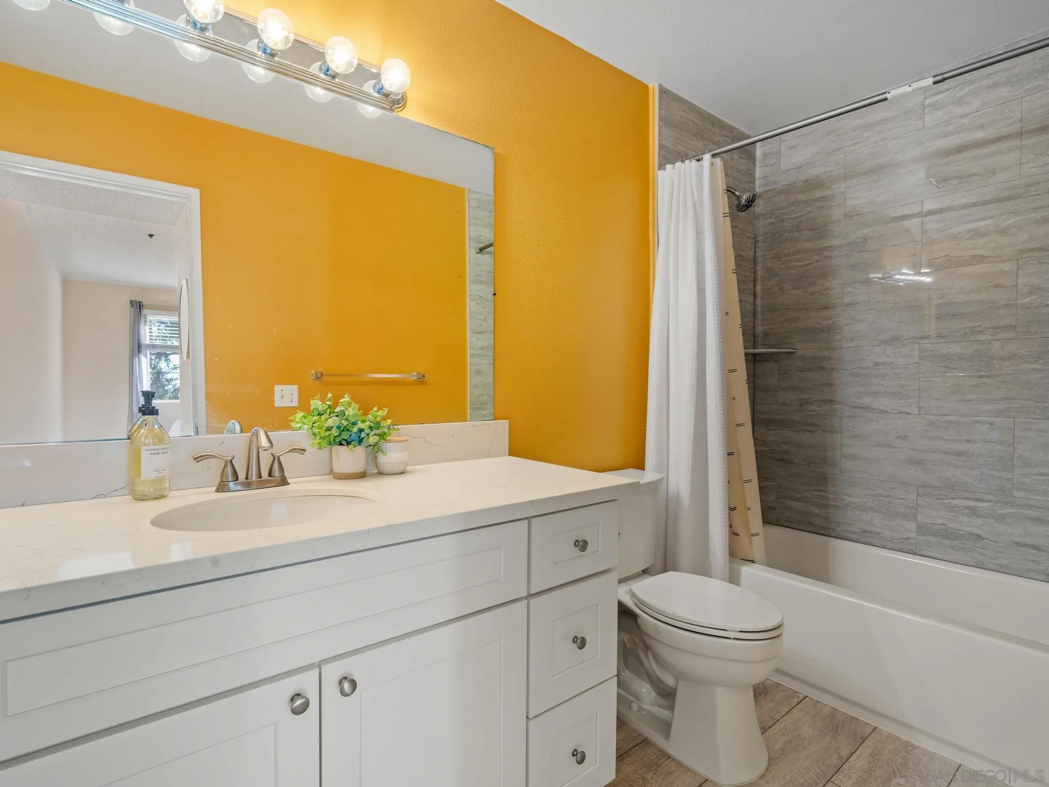 17161 Alva Road, Unit 2128 San Diego, CA 92127 - Photo 4 of 12 a bathroom with a sink a toilet and shower
