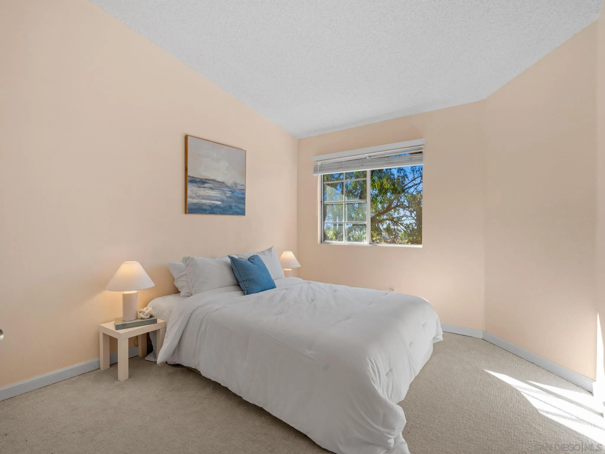 17161 Alva Road, Unit 2128 San Diego, CA 92127 - Photo 5 of 12 a bedroom with a bed and a window