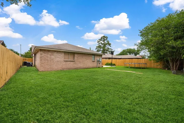a backyard of a house with lots of green space