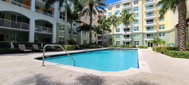 a view of a swimming pool with a lounge chairs