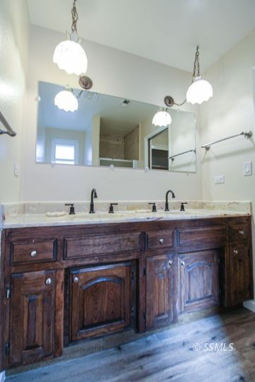 516 Randall Street Ridgecrest, CA 93555 - Photo 34 of 50 a spacious kitchen with stainless steel appliances granite countertop a sink cabinets and a fireplace