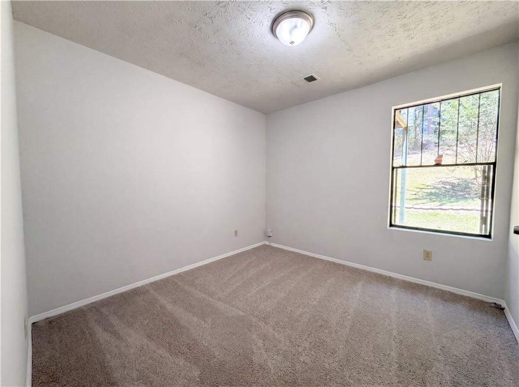 6830 Earlhurst Road Atlanta, GA 30349 - Photo 15 of 27 an empty room with windows