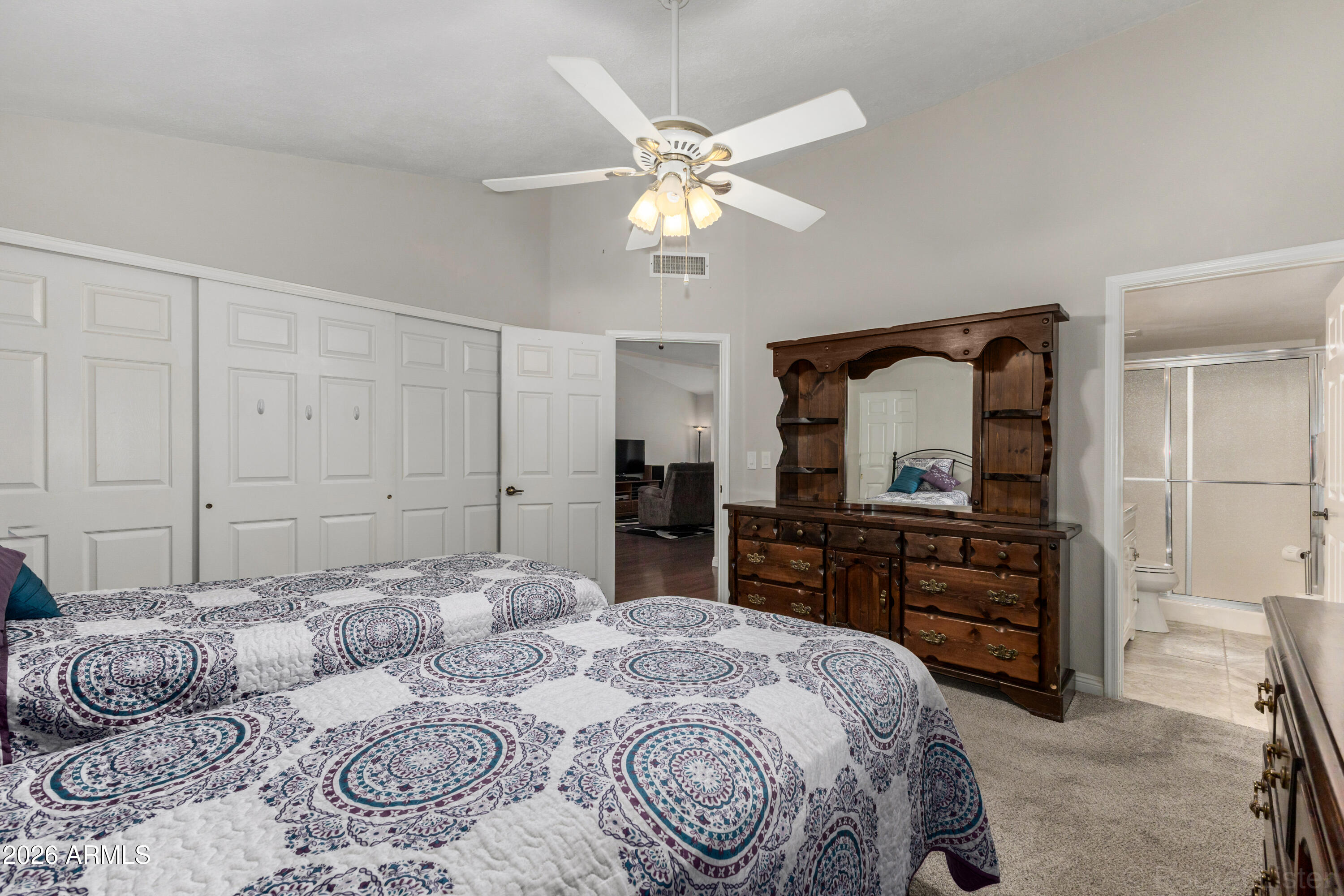542 South Higley Road, Unit 61 Mesa, AZ 85206 - Photo 16 of 33 a bedroom with a bed and a dresser
