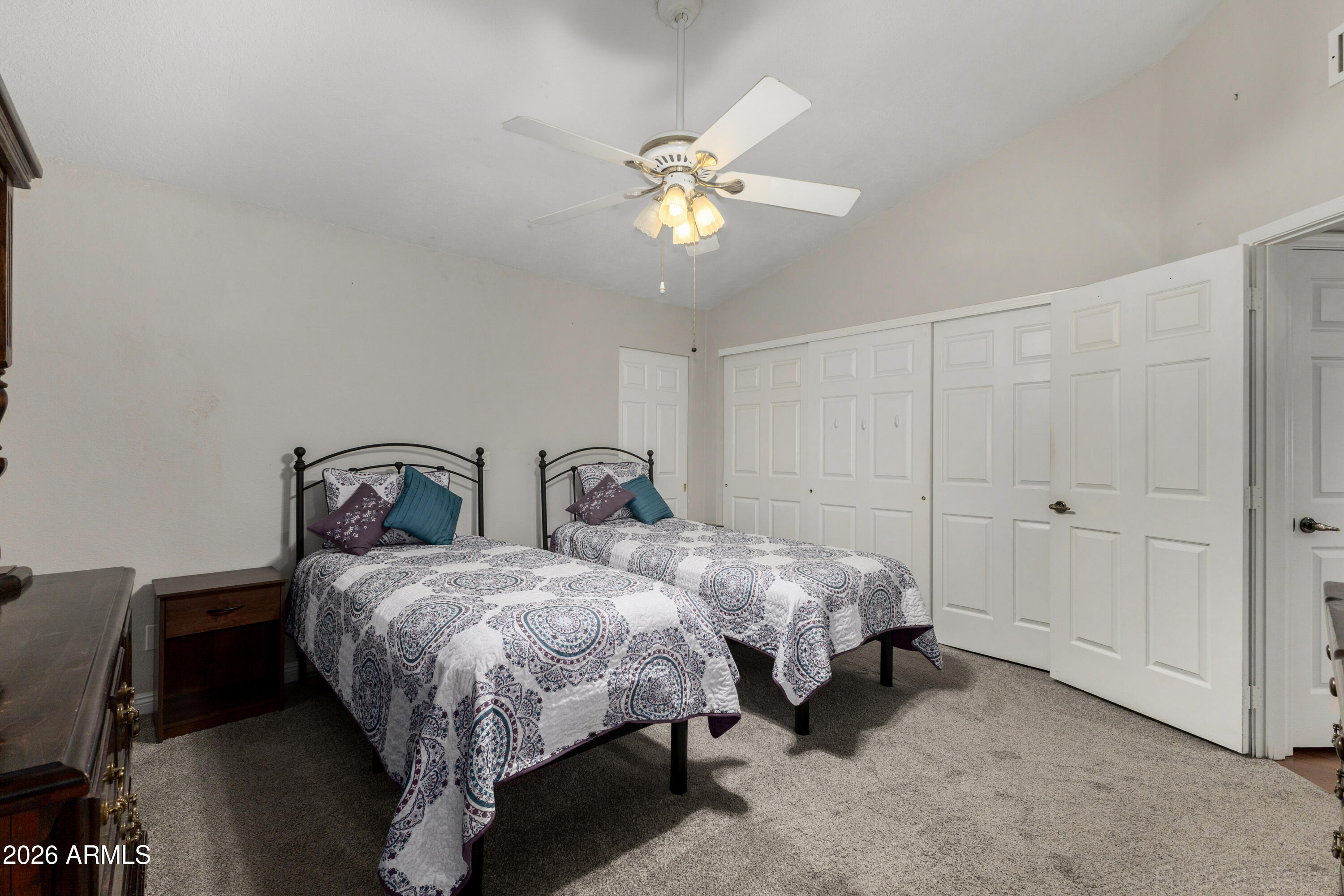 542 South Higley Road, Unit 61 Mesa, AZ 85206 - Photo 17 of 33 a bed room with two beds and a ceiling fan