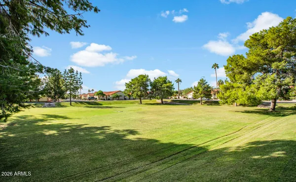 a view of a swimming pool with an outdoor seating
