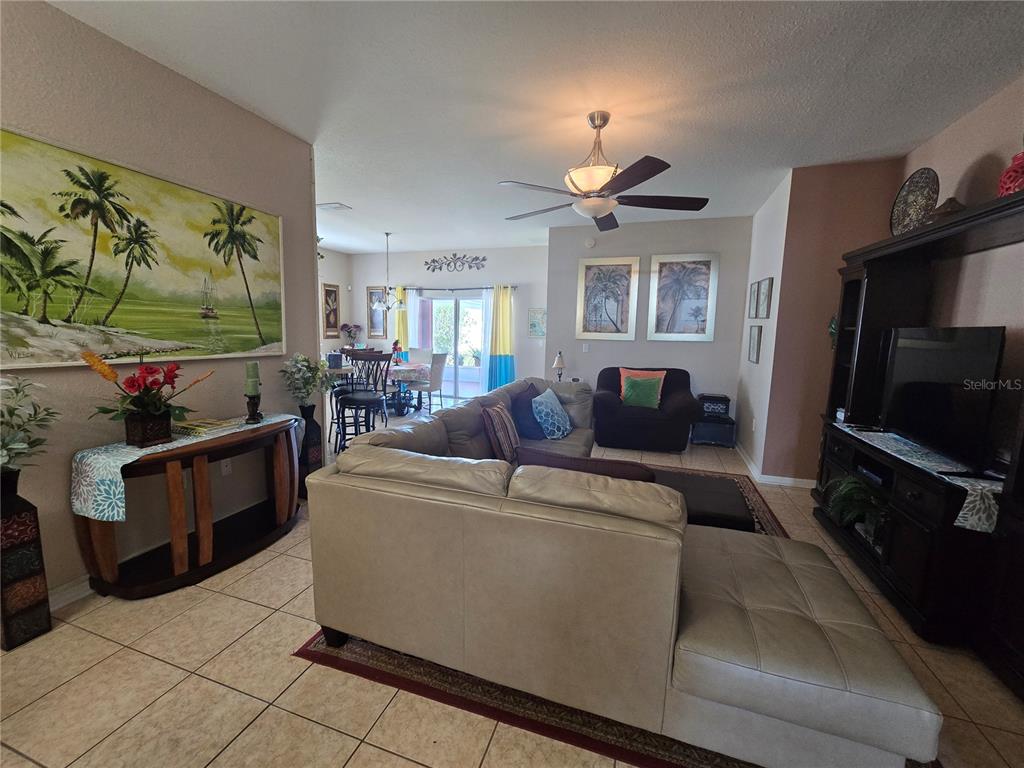 219 Cloverdale Road Winter Haven, FL 33884 - Photo 13 of 29 a living room with furniture and a flat screen tv