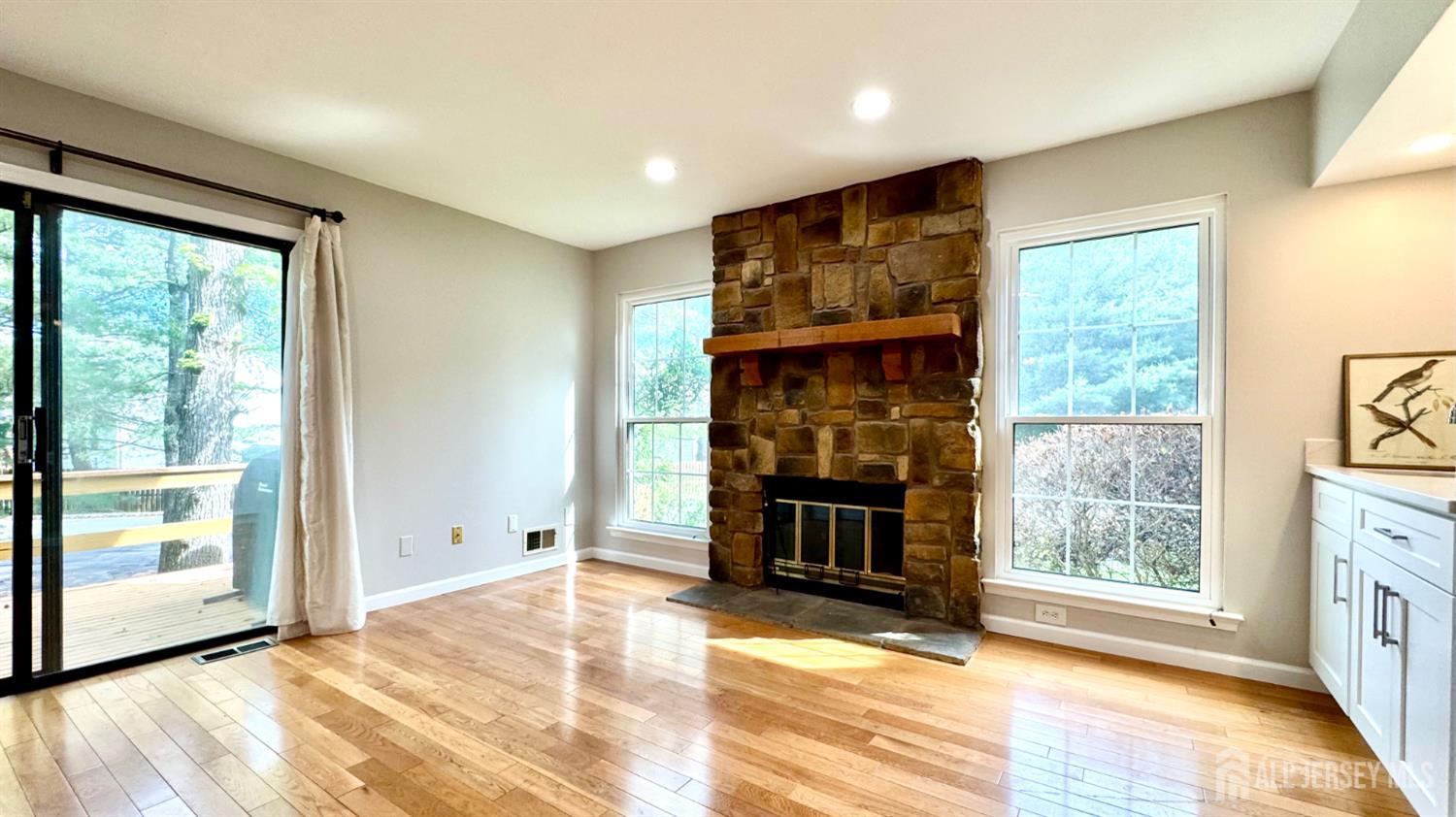 507 Timber Oaks Road Edison, NJ 08820 - Photo 5 of 17 a view of an empty room with a fireplace and a window