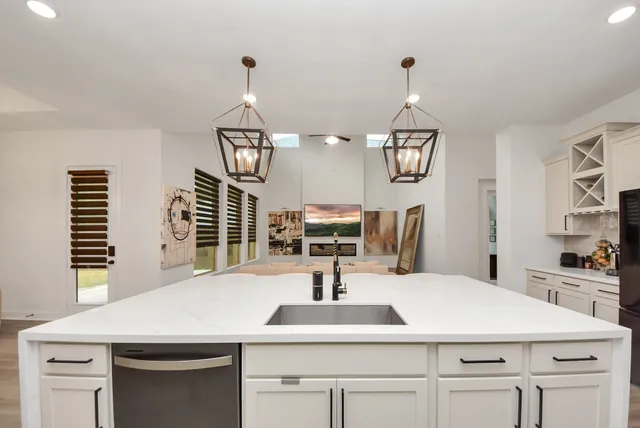 a stove top oven sitting inside of a kitchen
