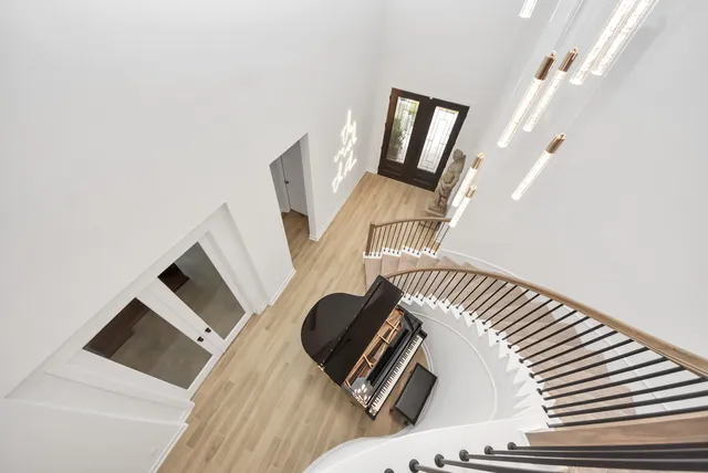 a room with furniture pool table and a window