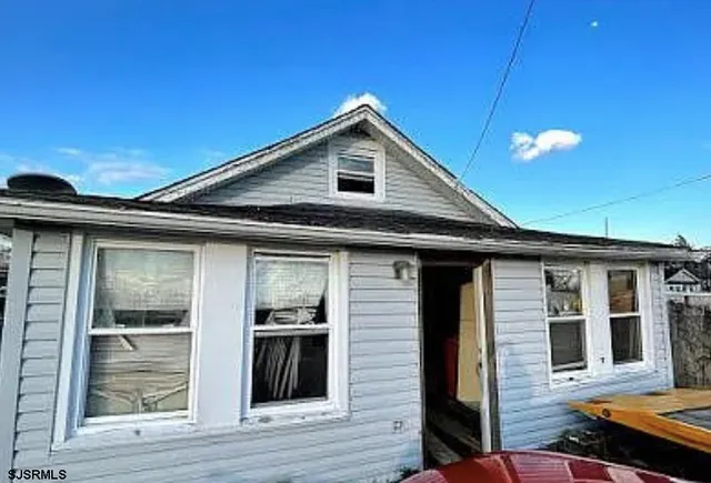 a front view of a house with yard