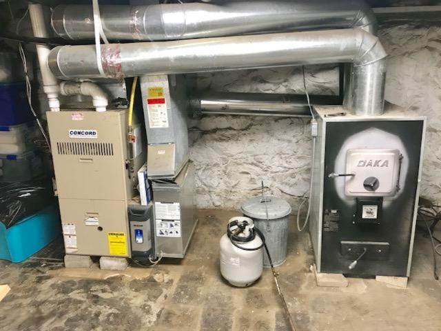 10364 Broadway Road Remus, MI 49340 - Photo 28 of 32 Furnace and Wood Stove combo.