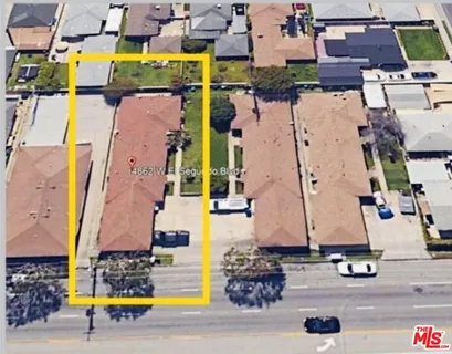 an aerial view of residential houses with outdoor space