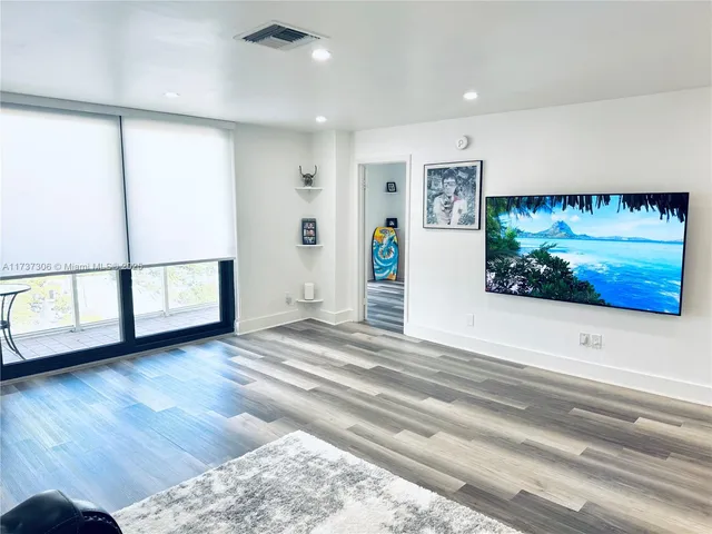 a view of livingroom with furniture and window