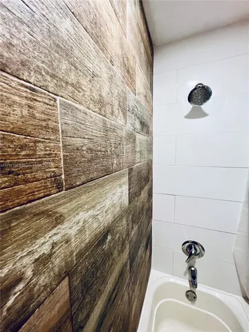 a bathroom with a sink and a shower