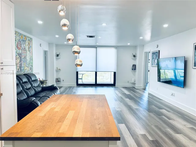 a living room with a couch and a flat screen tv