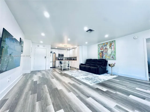 a kitchen with a sink stove and refrigerator