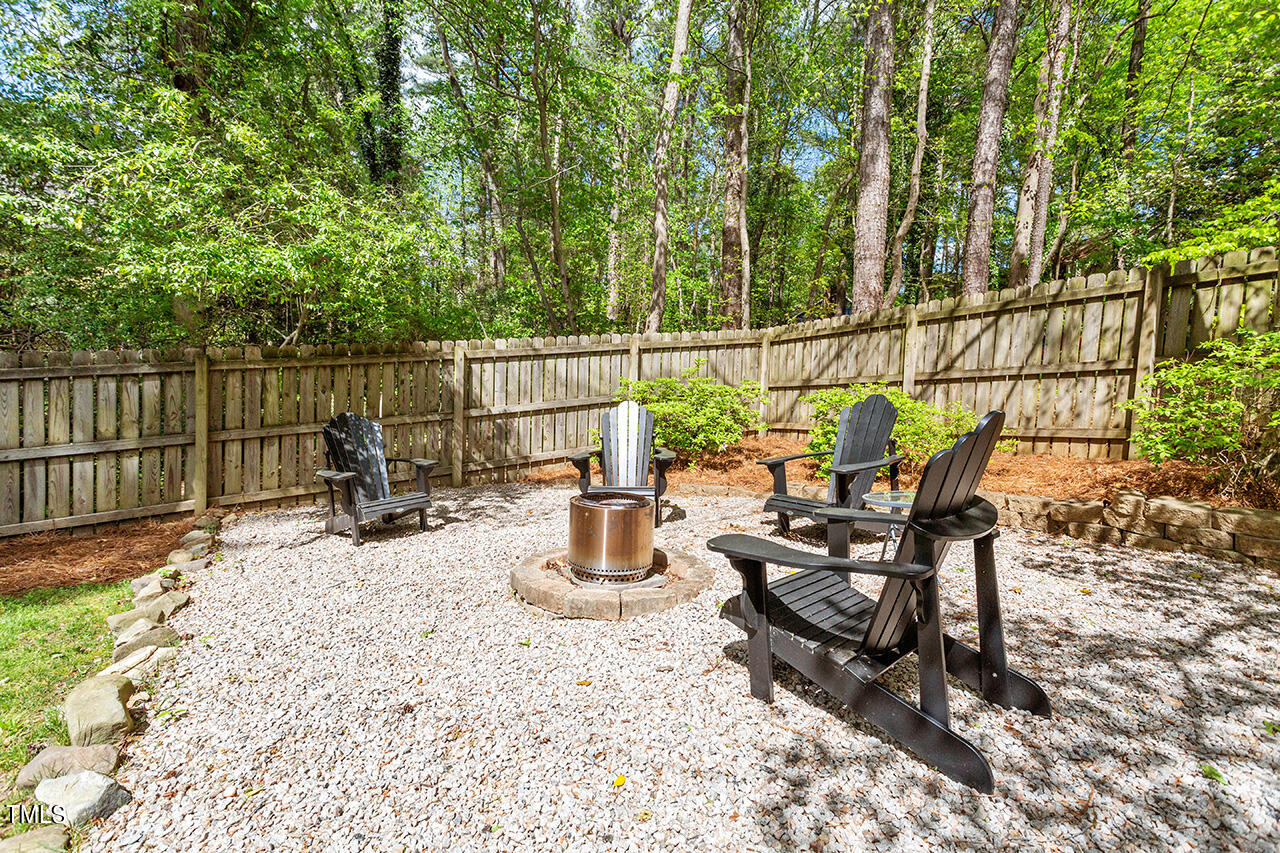 2520 Harptree Court Raleigh, NC 27613 - Photo 13 of 69 a view of a balcony with chair and potted plants