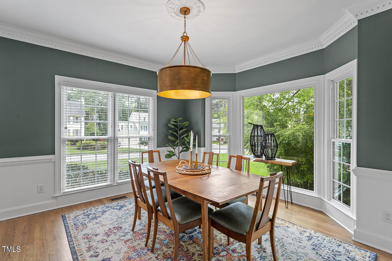 2520 Harptree Court Raleigh, NC 27613 - Photo 18 of 69 a view of a dining room with furniture window and wooden floor