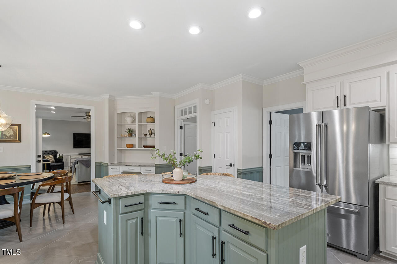 2520 Harptree Court Raleigh, NC 27613 - Photo 21 of 69 a kitchen with stainless steel appliances granite countertop a sink refrigerator and cabinets