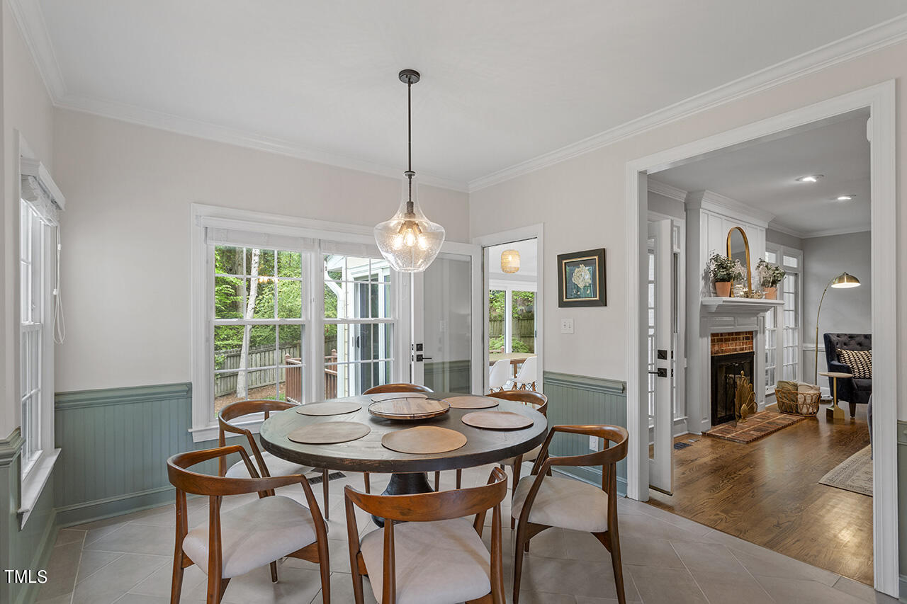 2520 Harptree Court Raleigh, NC 27613 - Photo 24 of 69 a view of a dining room with furniture window and wooden floor