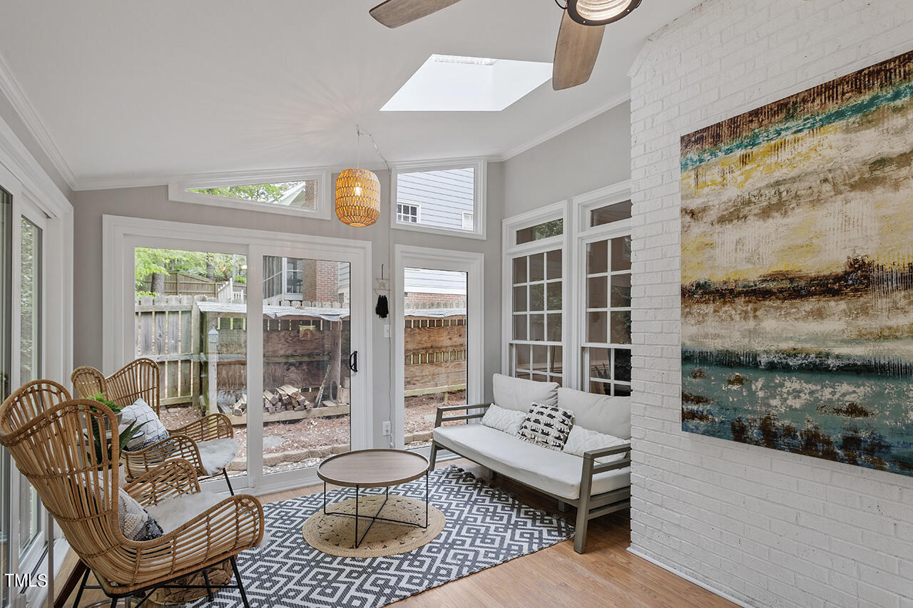 2520 Harptree Court Raleigh, NC 27613 - Photo 33 of 69 a living room with furniture and a floor to ceiling window