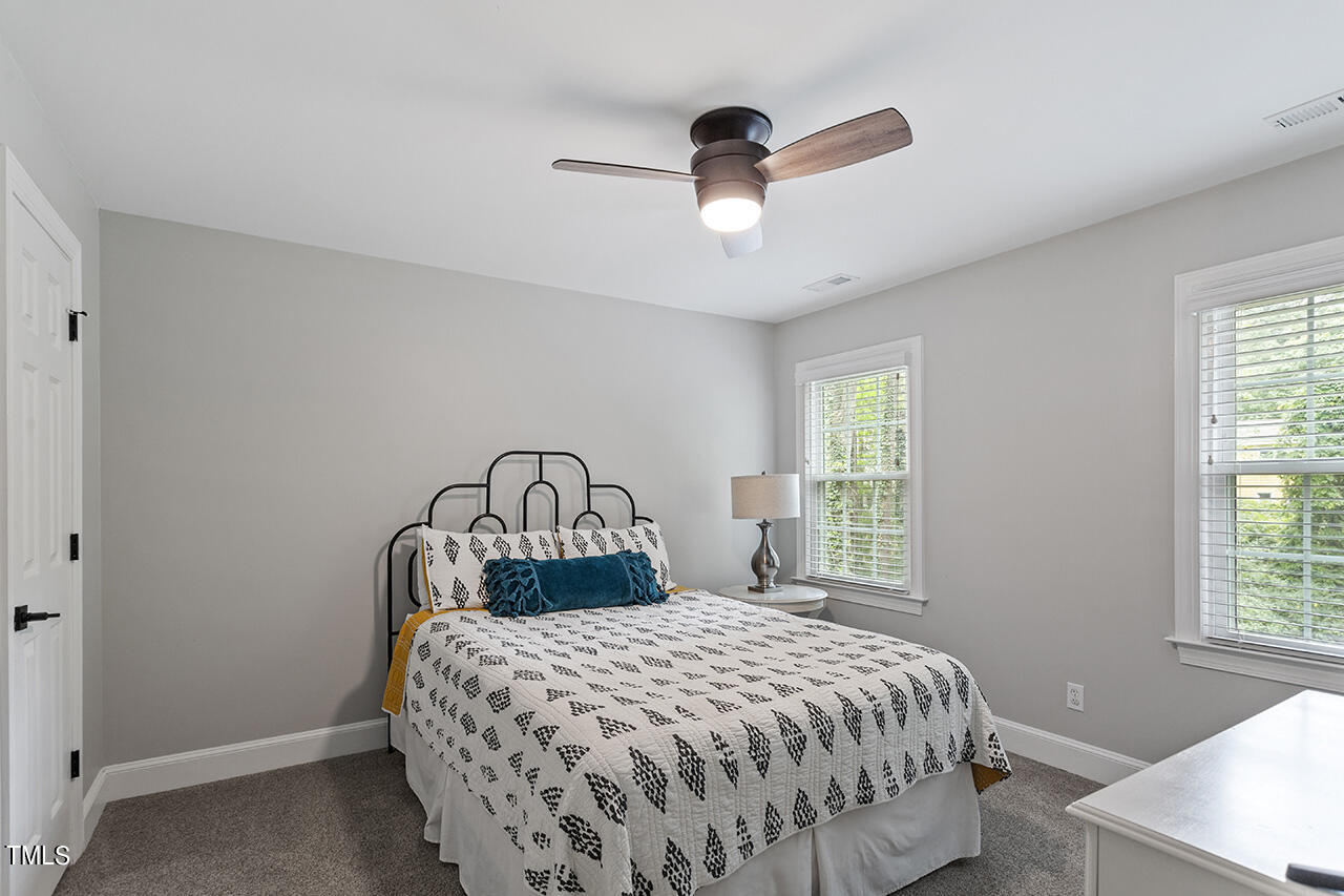 2520 Harptree Court Raleigh, NC 27613 - Photo 38 of 69 a bedroom with a bed and a window