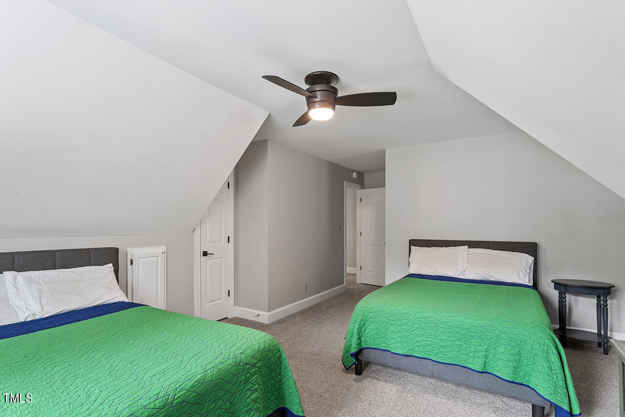 2520 Harptree Court Raleigh, NC 27613 - Photo 46 of 69 a bedroom with a bed and a window