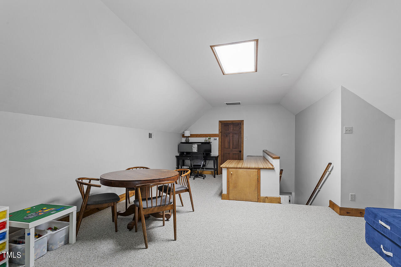 2520 Harptree Court Raleigh, NC 27613 - Photo 49 of 69 a room with furniture and a wooden floor