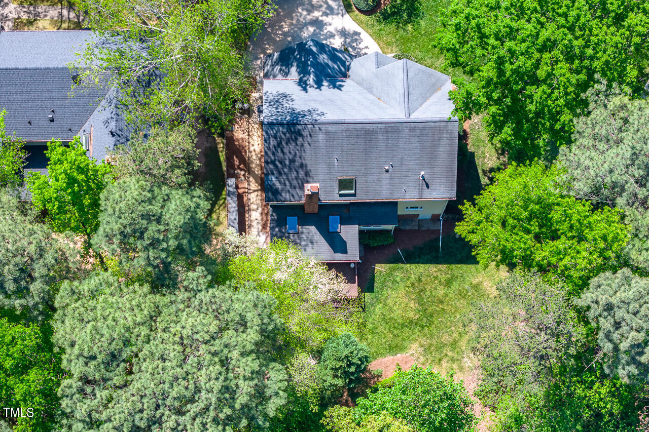 2520 Harptree Court Raleigh, NC 27613 - Photo 64 of 69 an aerial view of a house with a yard and large trees