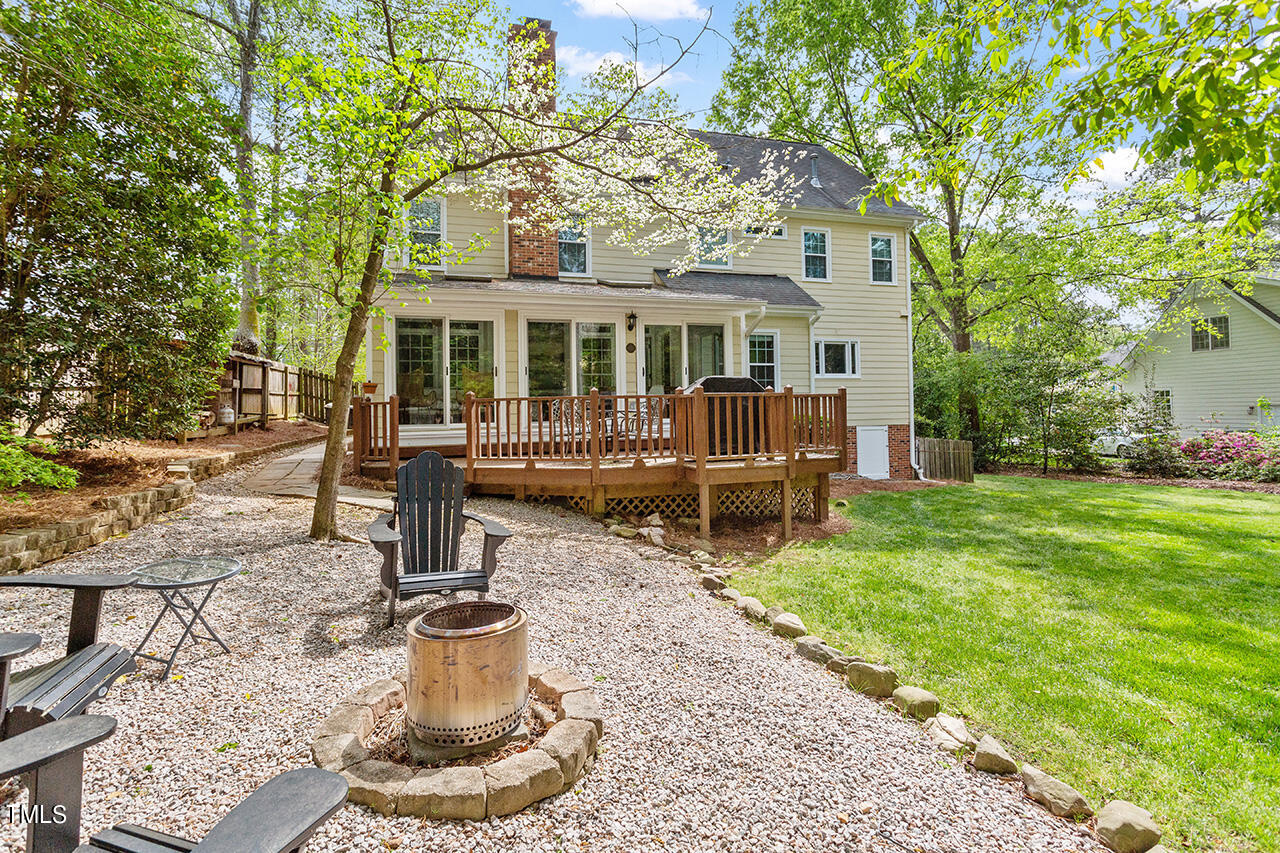 2520 Harptree Court Raleigh, NC 27613 - Photo 9 of 69 a view of a house with backyard sitting area and garden