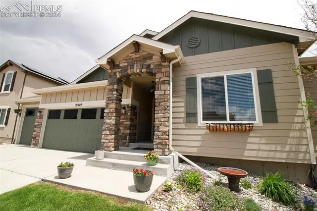 a front view of a house with a yard and porch