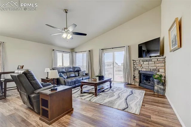 a bedroom with a bed and ceiling fan