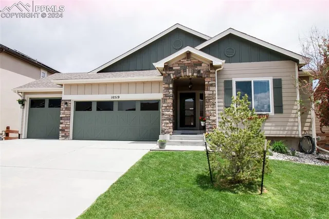 an aerial view of a house with a garden