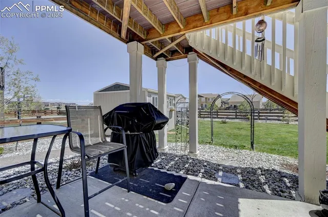 a view of a house with yard and stairs