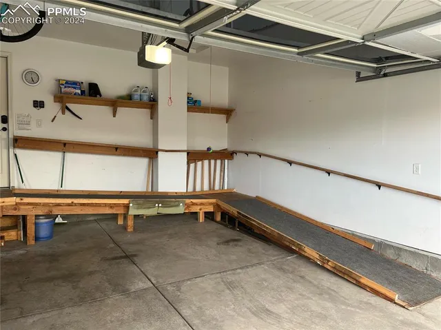 a view of a lake with a garden and swimming pool