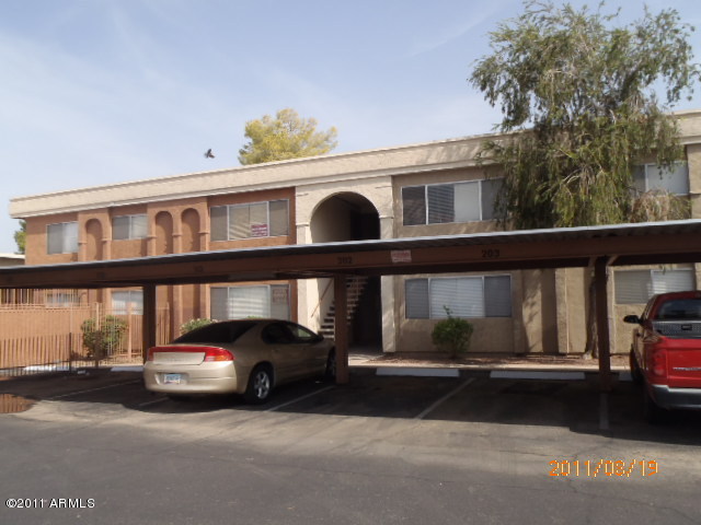 424 West Brown Road, Unit 106 Mesa, AZ 85201 - Photo 1 of 17 a view of a car in front of a house