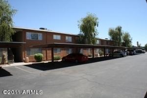 424 West Brown Road, Unit 106 Mesa, AZ 85201 - Photo 13 of 17 a front view of a house with a yard
