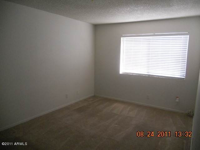 424 West Brown Road, Unit 106 Mesa, AZ 85201 - Photo 4 of 17 an empty room with a window