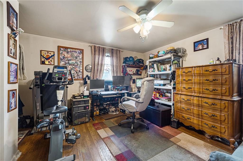 7148 Vann Road Pittsburgh, PA 15206 - Photo 20 of 36 a view of a workspace with furniture and a window