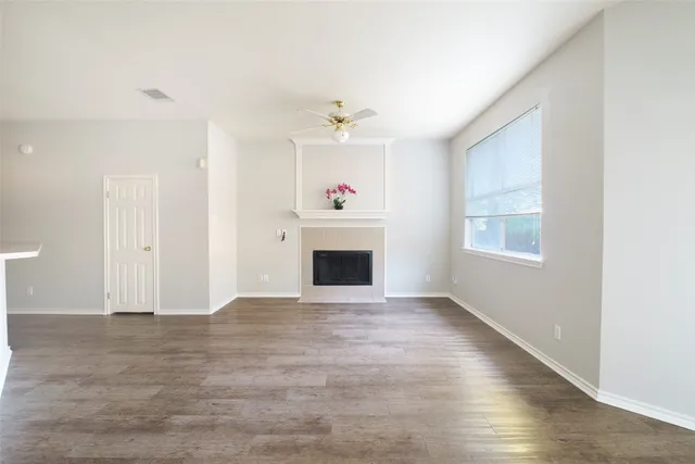 an entryway fireplace and windows in a room